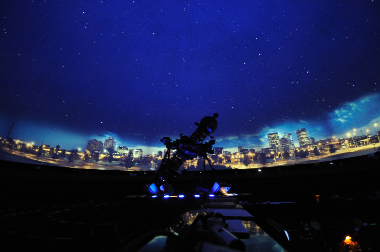 The planetarium projector is projecting the night sky 