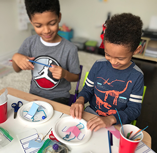 two students participating in a science experiment
