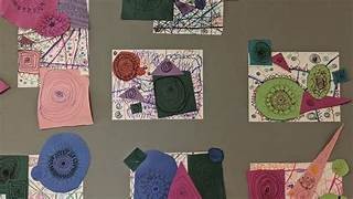 a collage of student art on a wall